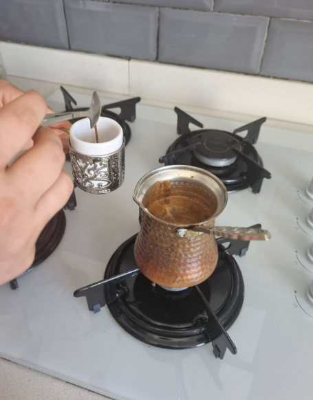 a photo showing the foam being removed with a teaspoon